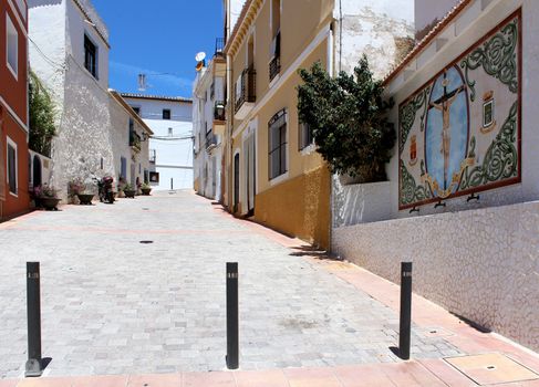 Public fountain at Plaza D. Manuel Miro, calle mar, historic old town center, Calp, Spain. Mediterranean spanish coastal city (Costa Blanca).