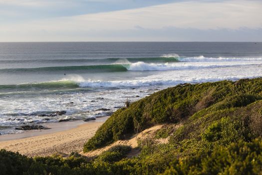 Perfect surfing waves line-up landscape of Jeffreys-Bay