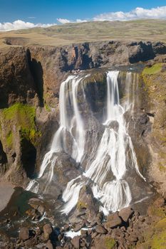 Fagrifoss ("Beautiful waterfall") is one of the most spectacular falls on Icealnd. It is located on the South not far from the volcano Laki