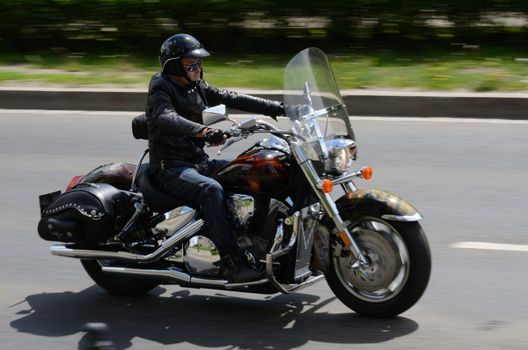 WROCLAW, POLAND - MAY 18: Unidentified motorcyclist rides Harley-Davidson motor during parade Super Rally. Around 8 thousands riders joined this event from 16 to 20 May 2013 in Wroclaw.