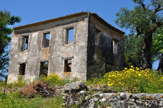 Abandoned house and spring landscape in rural Zakynthos, Greece. Example of pre-earthquake architecture.