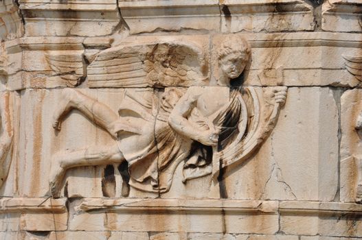 Tower of the Winds frieze detail of wind god pushing the stern of a ship. Ancient Agora, Athens Greece.