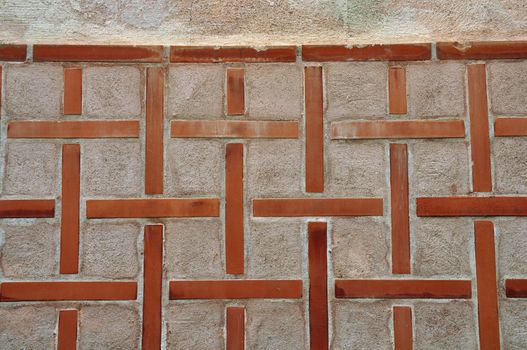 Cross pattern on old church wall exterior. Abstract background.