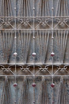 Vintage rusty pattern abstract door grille motif grungy background.