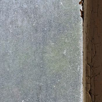 Dusty glass peeling wooden window frame abstract grungy background.