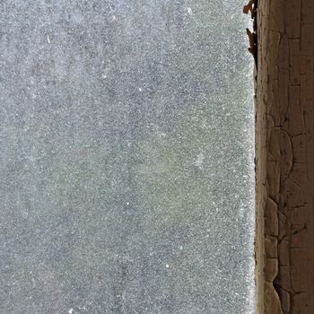 Dusty glass peeling wooden window frame abstract grungy background.