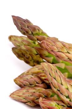 Heap of Perfect Fresh Raw Asparagus Sprouts isolated on white background