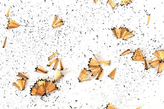 Graphite pencil shavings on white background. Arts abstract.