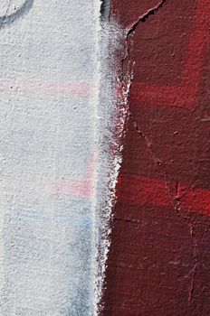 White paint smudged over textured wall. Abstract background.