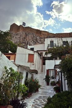 Small houses in the traditional Anafiotika neighborhood under the Acropolis. Cycladic islands village style architecture in the city of Athens, Greece.