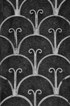Vintage rusty pattern floral motif abstract iron door background. Black and white.