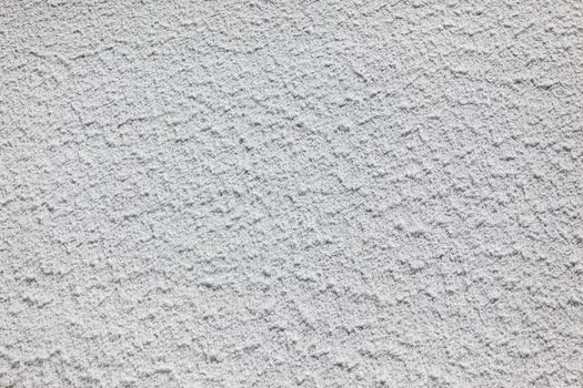 Volumes of water flowing over the high dam wall with texture and detail.