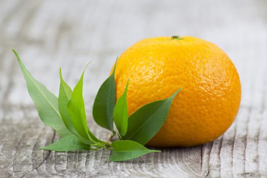 fresh tangerine on old wooden background