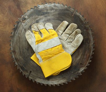  blade circular saw and gloves close up