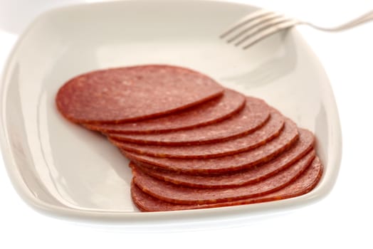 Salami slices on plate