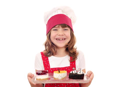 happy little girl cook with cakes