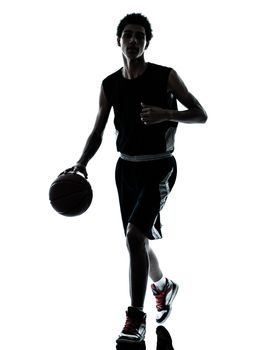 one young man basketball player dribbling silhouette in studio isolated on white background