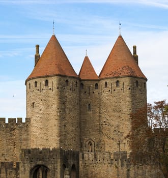 Carcassonne, France - November 2, 2013: View of the medieval walled city of Carcassonne and its castle on a sunny day.