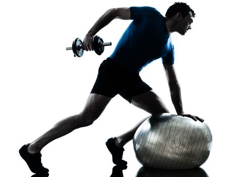 one caucasian man exercising weight training workout fitness in silhouette studio isolated on white background