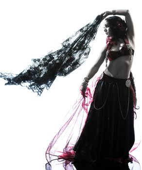 one arabic woman belly dancer dancing silhouette studio isolated on white background