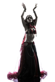 one arabic woman belly dancer dancing silhouette studio isolated on white background