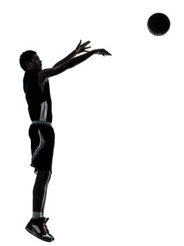 one young man basketball player silhouette in studio isolated on white background