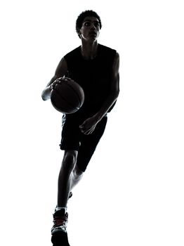 one young man basketball player dribbling silhouette in studio isolated on white background