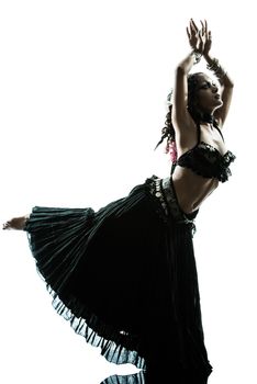 one arabic woman belly dancer dancing silhouette studio isolated on white background