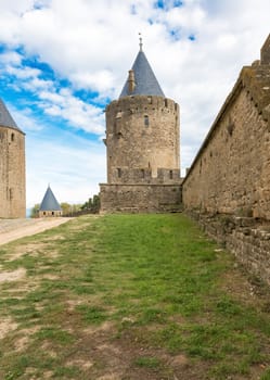 Carcassonne, France - November 2, 2013: View of the medieval walled city of Carcassonne and its castle on a sunny day.