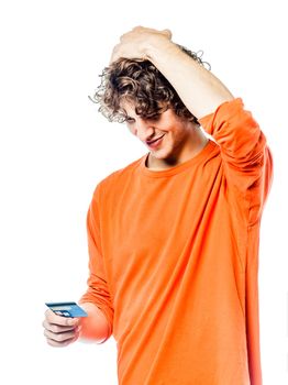 one young man caucasian holding credit card portrait in studio white background
