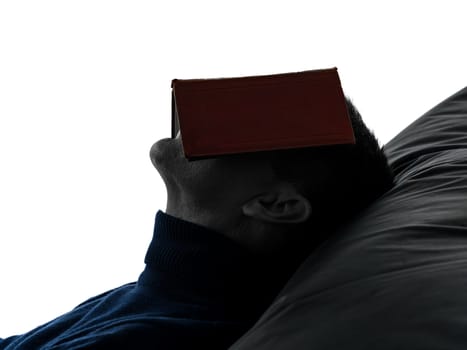 one caucasian man reading book portrait in silhouette studio isolated on white background