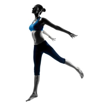one caucasian woman exercising jumping stretching dancing in silhouette studio isolated on white background