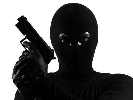 thief criminal terrorist holding gun portrait in silhouette studio isolated on white background