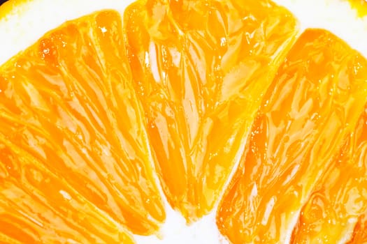 Slice of fresh orange fruit closeup macro