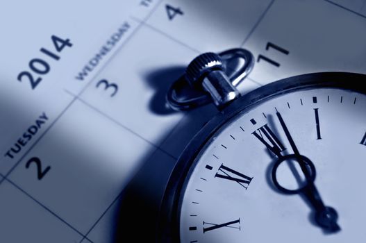 Vintage clock on a 2014 calendar