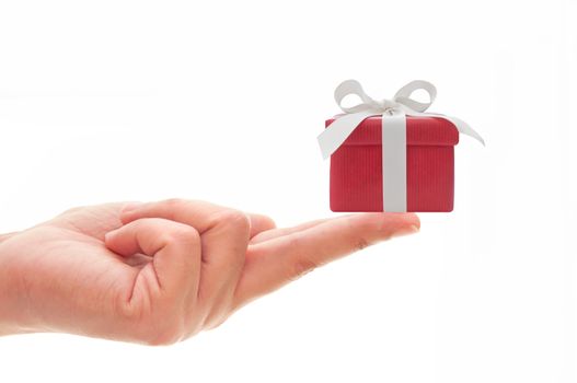 Hand holding a small gift box 