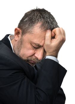 Headache. Portrait of an middle age man with face closed by hand. Isolated on white
