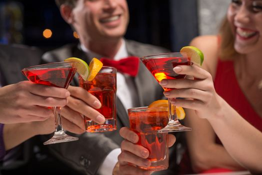 close-up of hands with glasses, a toast, party with friends