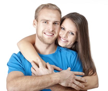 portrait of a happy young couple smiling, looking - isolated on white