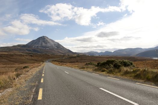 road to the Errigal mountains in county Donegal Ireland on a bright cloudy day