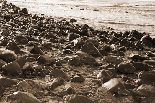 rocky coastline of a county Kerry beach on Irelands west coast in sepia