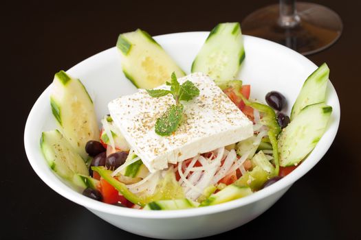 Mediterranean style or Greek garden salad with fresh goat cheese.