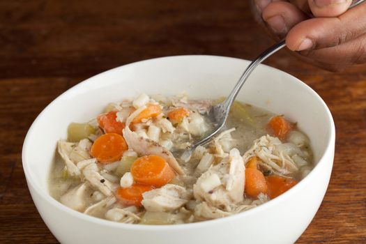 Hot bowl of fresh homemade traditional chicken soup.