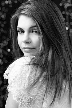 Friendly smiling young woman portrait studio shot