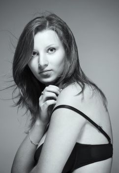 portrait of a young beautiful woman with brown hair in lingerie