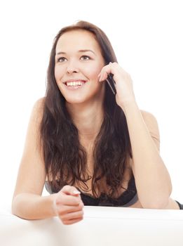 young girl talking on her mobile phone smiling