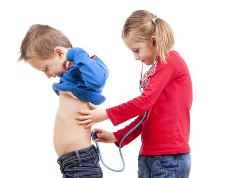 brother and sister playing a doctor with stethoscope - isolated on white