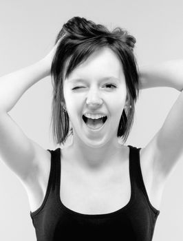 beautiful teenage girl in black screaming - black and white