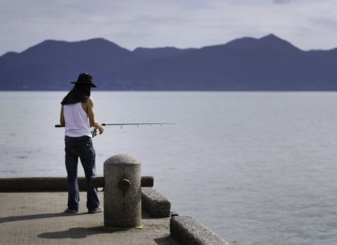 Fisherman fishing trolling in the sea, Chonburi, Thailand