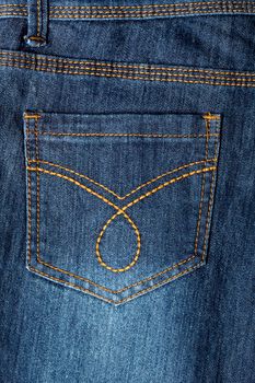 Closeup image of a denim jeans, back pocket